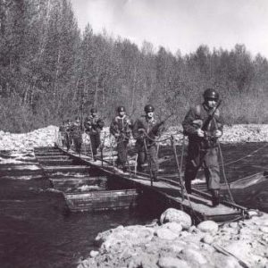 Chilliwack Progress Press Photograph: Infantry Pioneers attached to 3 Field Squadron RCE use an aluminum floating draw bridge to cross the turbulent Chilliwack River, 9 May 1962 [1999.029.021.023]